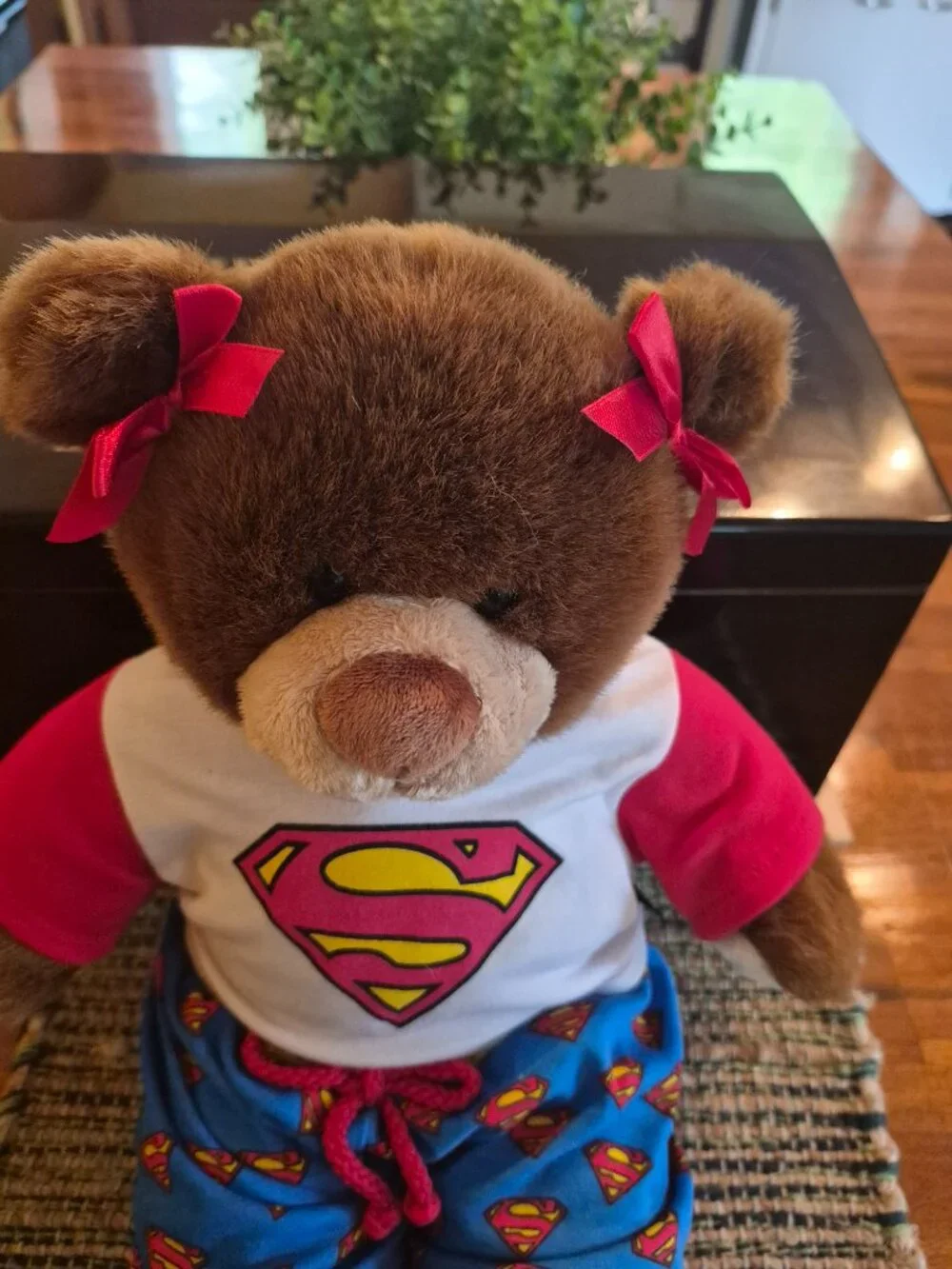 Build-A-Bear Workshop teddy bear wears a casual Superman-themed outfit with bows